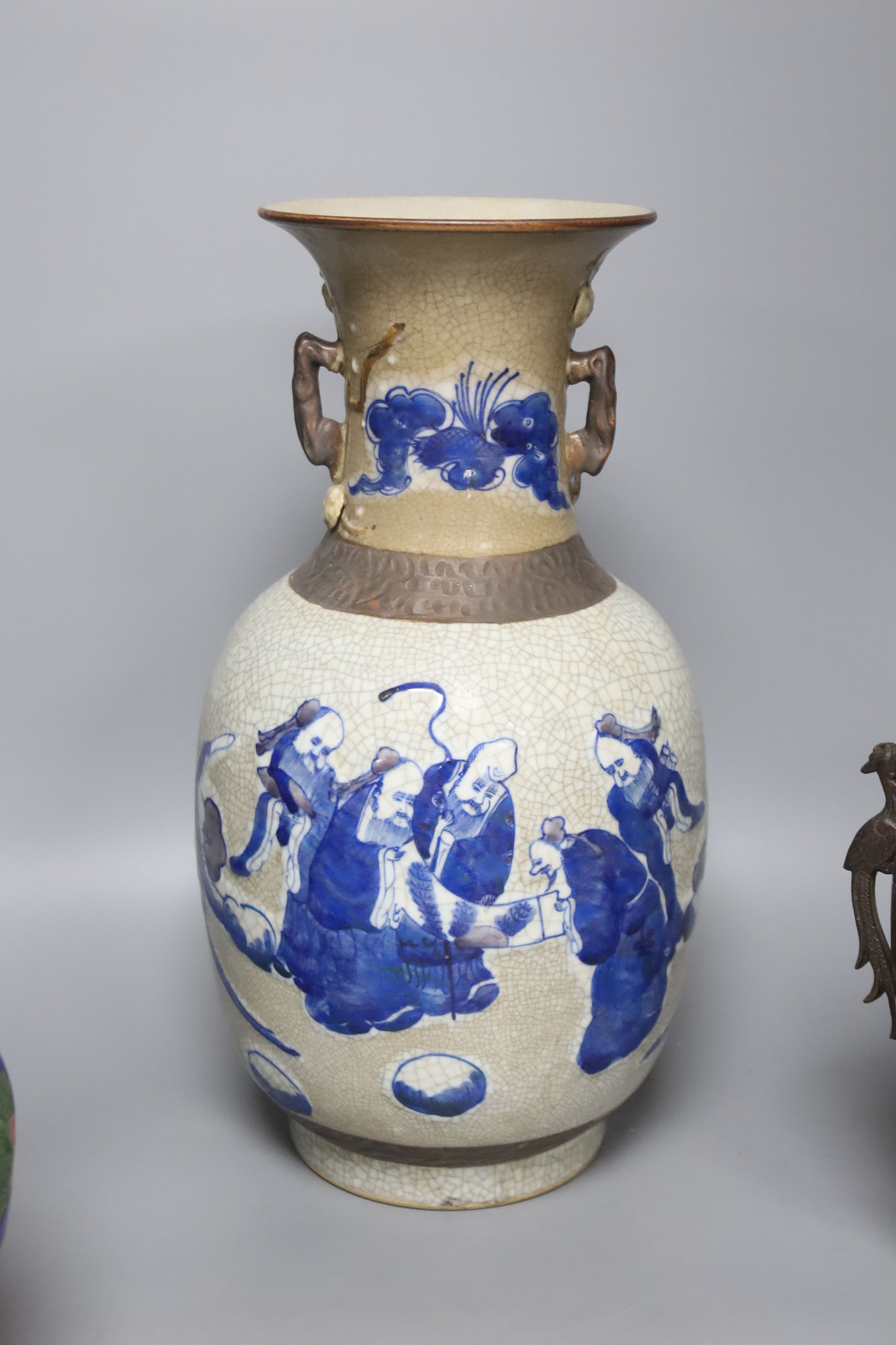 A Chinese blue and white crackle glaze vase, a similar cloisonne vase and a bronze vase, tallest 38cm